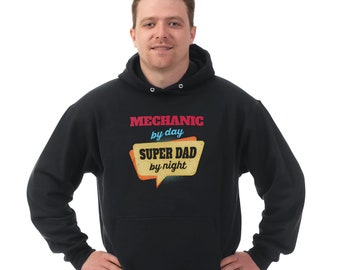 May include: Black hooded sweatshirt with the text "Mechanic by day Super Dad by night" in a retro-style speech bubble.