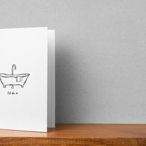 May include: A white greeting card with a black line drawing of a vintage bathtub with a faucet and a towel. The text "I'd do it." is printed below the illustration.