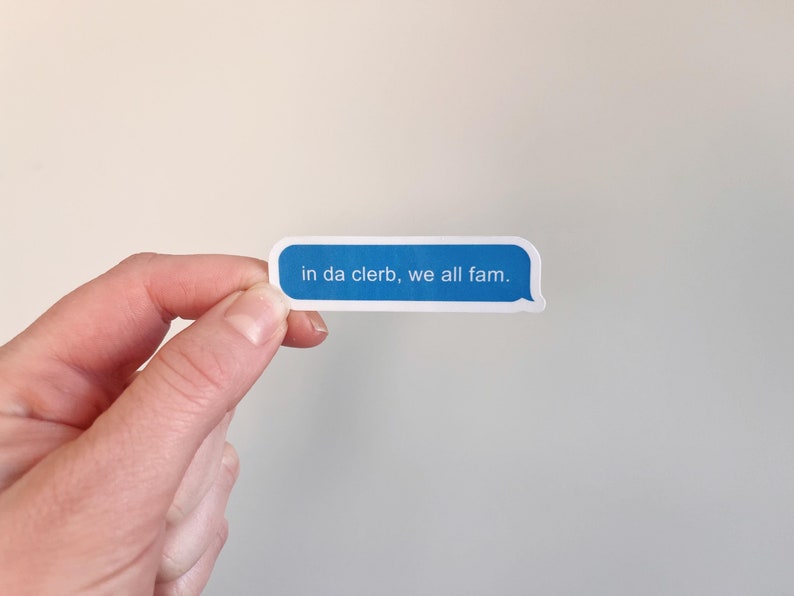 May include: A blue and white sticker with the text "in da clerb, we all fam."