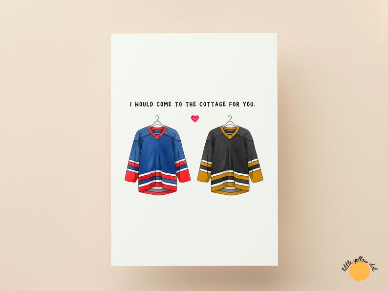May include: Greeting card with the text "I would come to the cottage for you." Features illustrations of two hockey jerseys, one blue and red, the other black and gold, with a small pink heart.