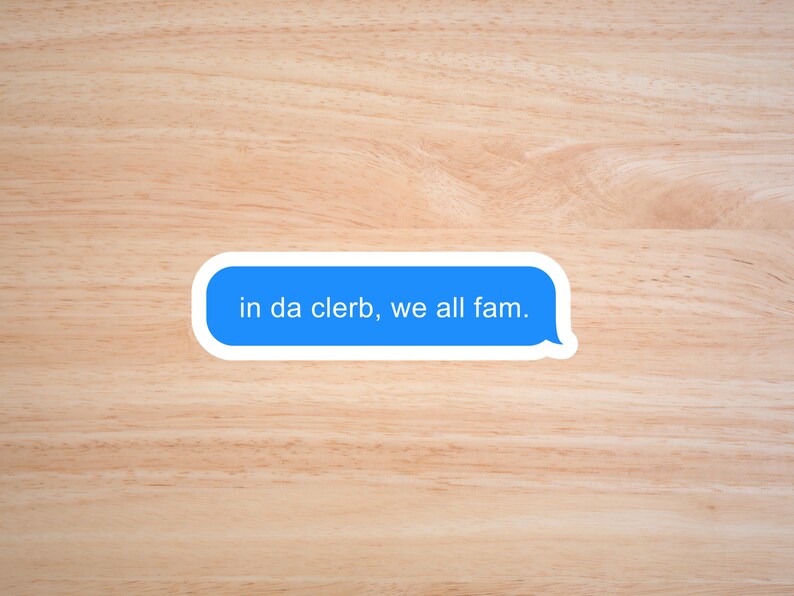 May include: A blue text message bubble on a wood background with the text "in da clerb, we all fam."
