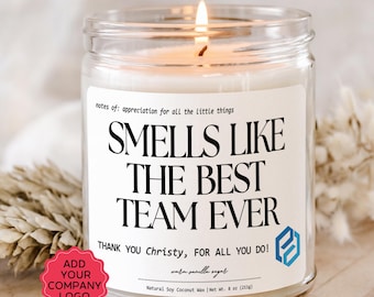 May include: A lit soy wax candle in a clear glass jar. The label reads "Smells Like The Best Team Ever" with a thank you message. The candle is 8 oz (211g) and has a vanilla sugar scent. A red sticker says "Add Your Company Logo."