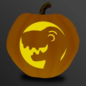 May include: A carved orange pumpkin with a dinosaur silhouette design. The dinosaur is in a yellow circle, with its teeth and eye visible. The pumpkin has a green stem and is set against a dark gray background.