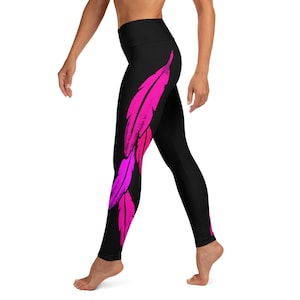 May include: Black leggings with a pink and purple feather design on the left leg.
