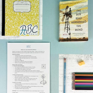 May include: A yellow composition notebook, a book titled "The Boy Who Harnessed the Wind", and instructions for making a windmill. Also included are coloured pencils, a pencil, and an eraser. The book's cover features a windmill.