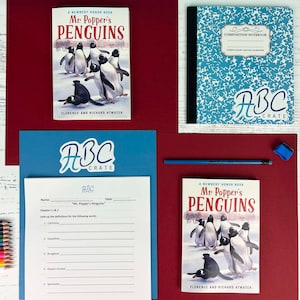 May include: A blue and white composition notebook with the text "ABC Crate" on the cover.  The notebook is next to a copy of the children's book "Mr. Popper's Penguins" by Florence and Richard Atwater.  A worksheet with the title "Mr. Popper's Penguins" is also included.