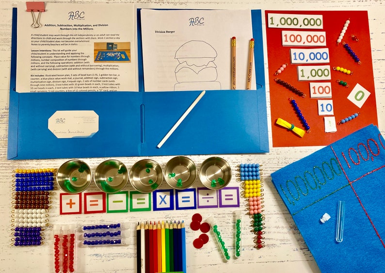 May include: A blue folder with a white pencil and a sheet of paper with a drawing of a hamburger. A red folder with a set of colorful beads and cards with numbers from 10 to 1,000,000. A blue felt board with a grid and the numbers 1000 and 100. A set of colorful beads, metal cups, and math symbols.