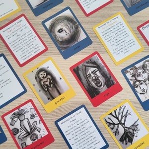 May include: A set of colourful cards with black and white illustrations and text. The cards feature different emotions and states of mind, such as rage, grounded, grateful, and shut-down. The cards are designed to help people understand and manage their emotions.