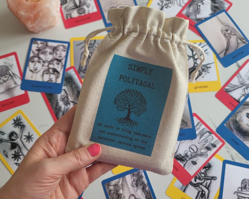 May include: A white canvas bag with a blue label that says "Simply Polyvagal" and has a tree with roots on it. The bag contains 42 cards to help understand the autonomic nervous system.