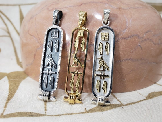 Amazon.com: Egyptian Dark Ebony Winged Isis Sterling Silver Cartouche Charm  Pendant In Hieroglyphics or Arabic Or English - Made By AYALZ - Up to (8  Characters) : Handmade Products