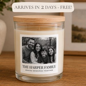 May include: A clear glass candle jar with a light-colored wax fill and a round wooden lid. The front label features a black and white photograph of a family of four, with the text THE HARPER FAMILY and MAKING MEMORIES TOGETHER printed below.