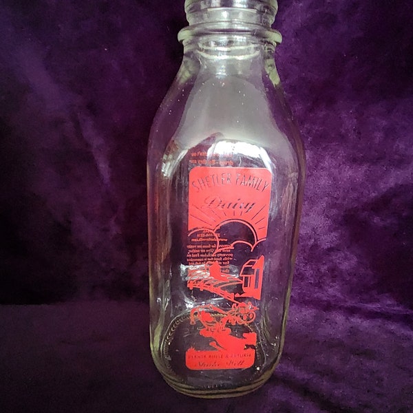 Vintage clear with red graphics Shetler dairy bottle