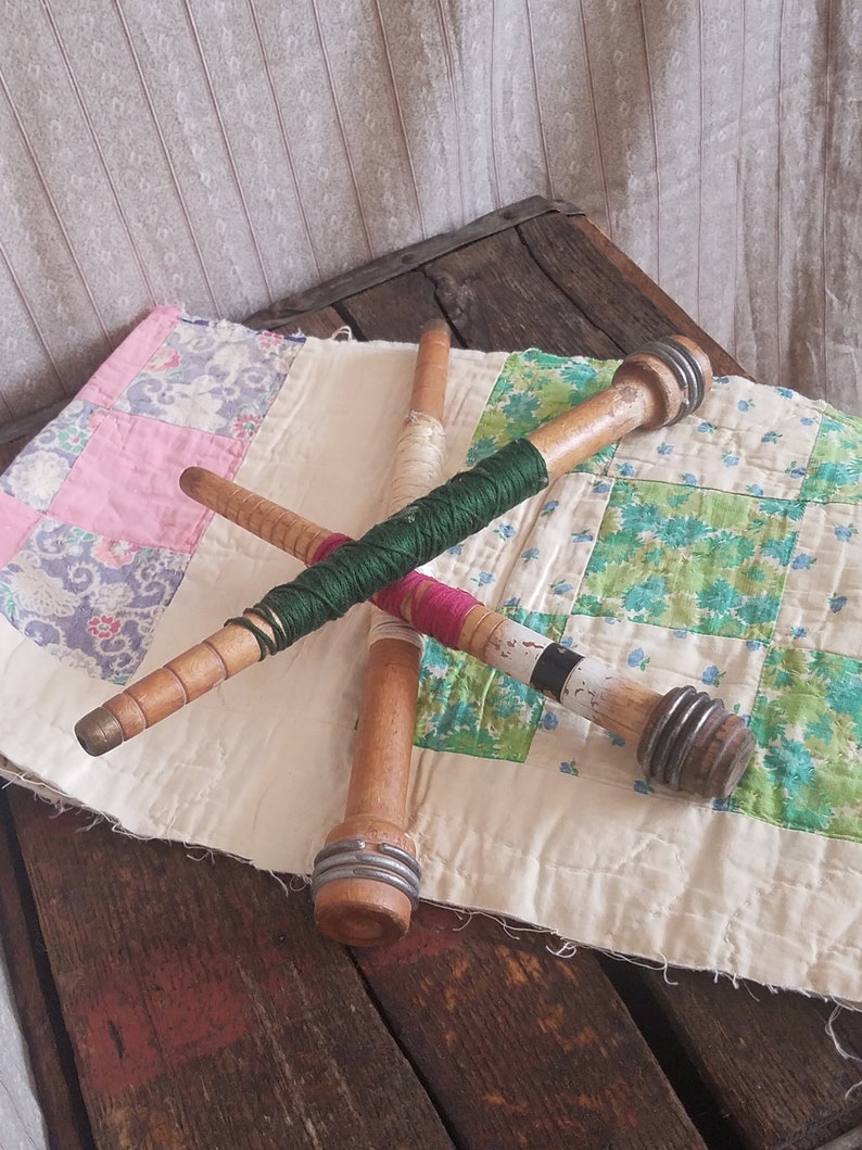 3 vintage wooden bobbin spools