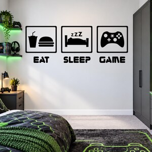 Boîtes de jeux Eat Sleep - Sticker mural décoratif pour chambre de garçon avec citation de jeu vidéo - Sticker vinyle - Décoration murale pour adolescent gamer - Grand sticker graphique mural