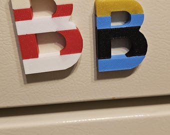 Invincible B Fridge magnets