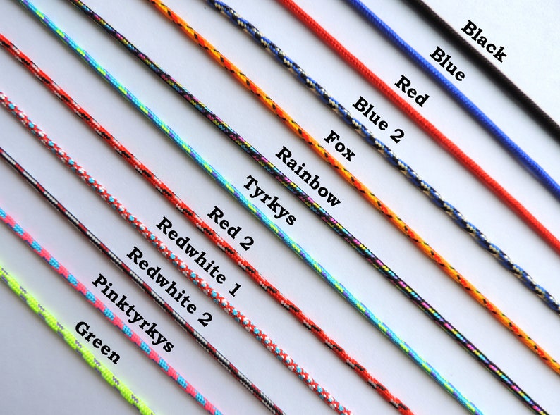 May include: A variety of colorful cords with different patterns and names, including Black, Blue, Red, Blue 2, Fox, Rainbow, Tyrkys, Red 2, Redwhite 1, Redwhite 2, Pinktyrkys, and Green.