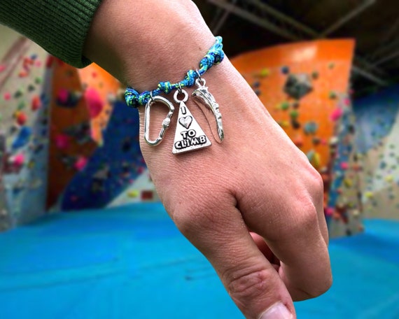 Bracciale da arrampicata con moschettone in titanio