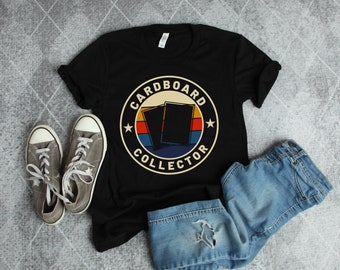 May include: Black t-shirt with a vintage-style logo that says "Cardboard Collector". The logo features a red, yellow, and blue color scheme and two stacked cardboard rectangles.