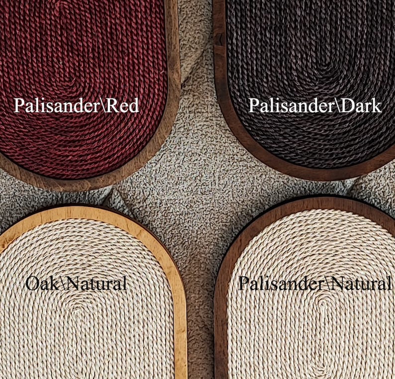 May include: Four oval-shaped cat scratching posts with different wood and rope colors. The posts are made of wood and have a rope covering. The colors are red, dark brown, natural, and natural. The text on the posts reads "Palisander/Red", "Palisander/Dark", "Oak/Natural", and "Palisander/Natural".