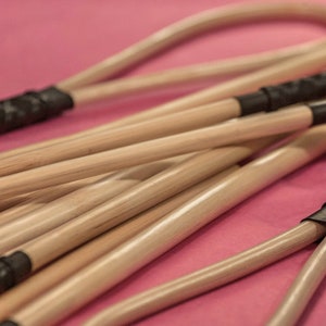 Rattan loop coated in transparent rubber for punishments