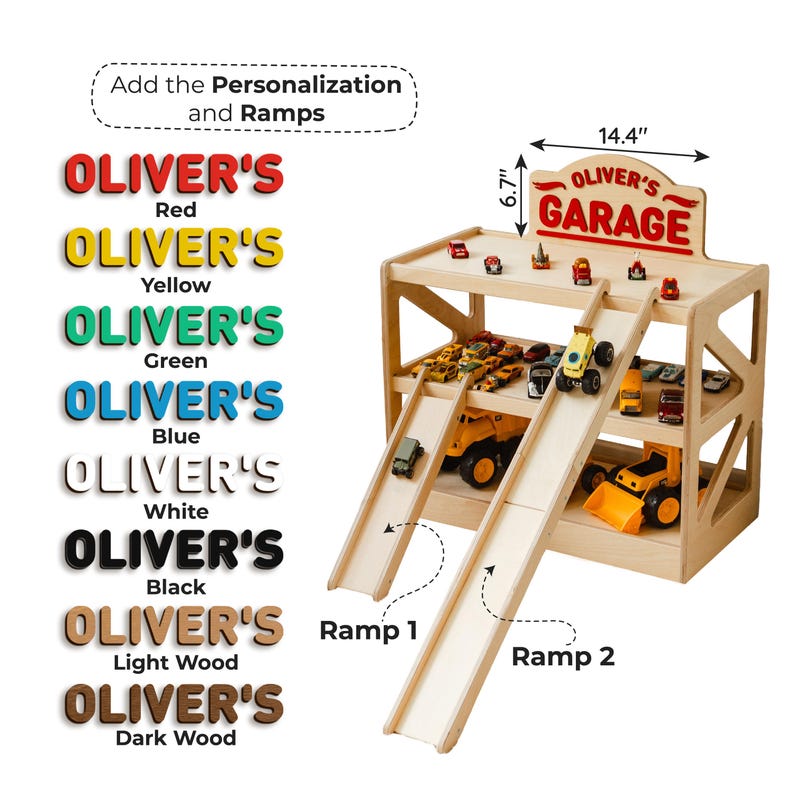 May include: A wooden toy garage with two levels, two ramps, and a sign reading OLIVER'S GARAGE. The sign measures 14.4 inches wide by 6.7 inches high. A list of color options for the name personalization is shown in red, yellow, green, blue, white, black, light wood, and dark wood.