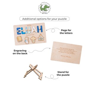 May include: Wooden puzzle with the name "ELIJAH" in blue and white letters, with the word "BLESS" above and "Forevermore" below. Includes pegs, engraving options, and a stand. Features religious symbols.