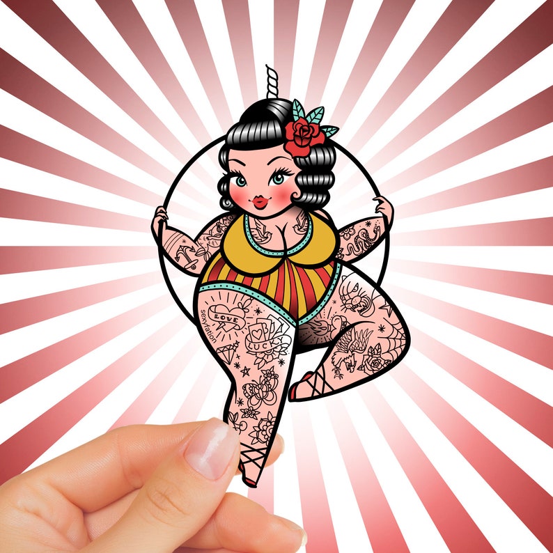 May include: A cartoon illustration of a woman with tattoos, a unicorn horn, and a red rose in her hair. She wears a yellow and red striped swimsuit and is holding onto a black hoop. The background has red and white radial stripes.
