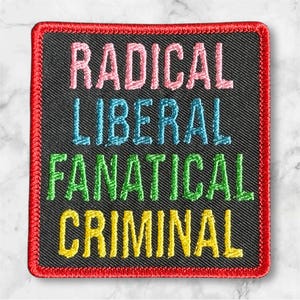 May include: Square black patch with red stitched border. The patch features the words "RADICAL," "LIBERAL," "FANATICAL," and "CRIMINAL" in pink, blue, green, and yellow embroidered letters.