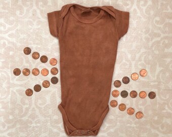 rust colored baby onesie