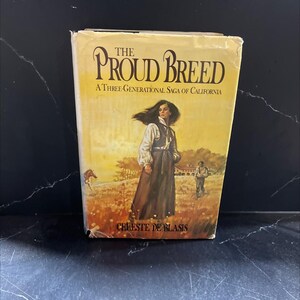 May include: A vintage paperback book titled "The Proud Breed" by Celeste De Blasis. The cover art depicts a woman in a long dress and a man in a field. The book is a three-generational saga of California.