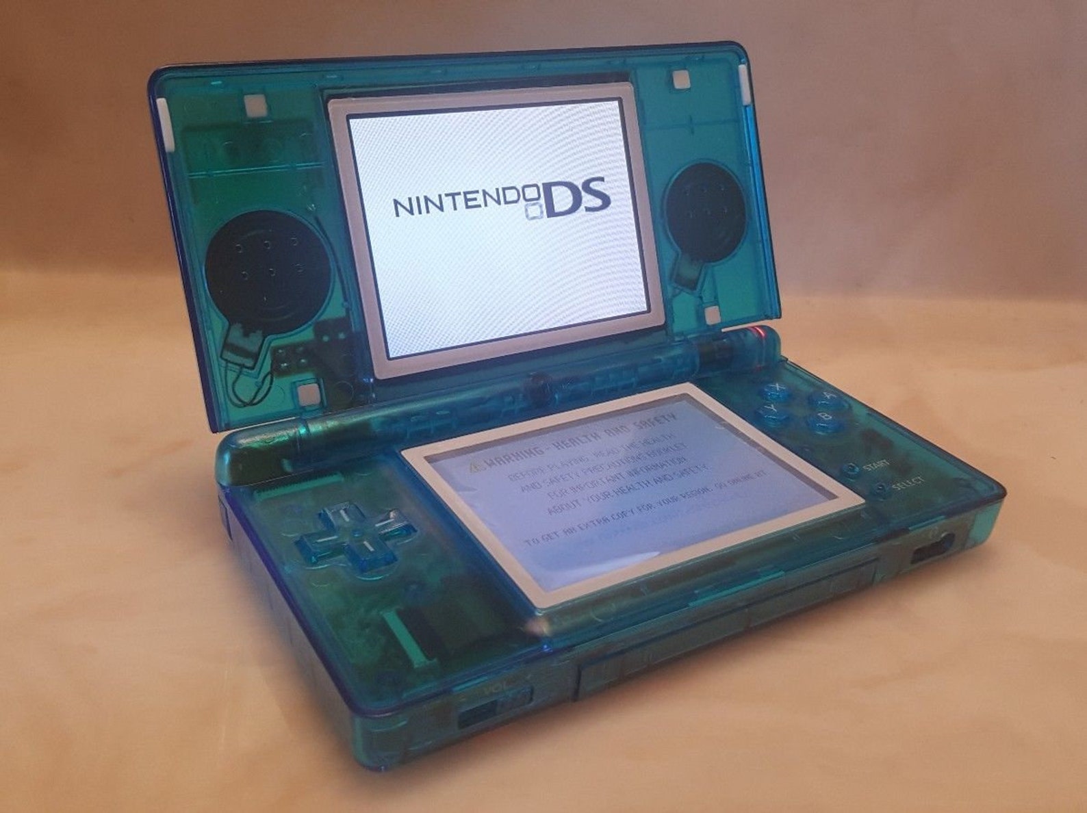 Nintendo DS Lite console New CLEAR BLUE shell with charger.
