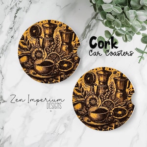May include: Two round cork car coasters with a coffee-themed design. The coasters feature a detailed illustration of coffee pots, a cup of coffee, and orange slices in shades of brown and gold. The text "Cork Car Coasters" is visible.