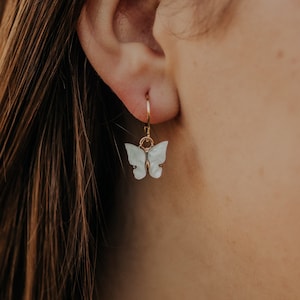 Gold hoops with white butterfly charms