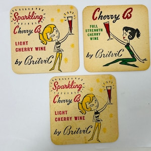 Vintage coasters Beer mats bar mats Cherry B Full Strength Cherry Wine Britvic Hemel Hempstead, England with graphics of 1950s women
