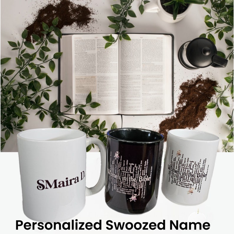 May include: Three white ceramic mugs with black lettering. One mug has the name "SMa&iacute;ra D." printed on it. The other two mugs have the words "Women in the Bible" printed on them. The mugs are on a white surface with a book and coffee grounds in the background.