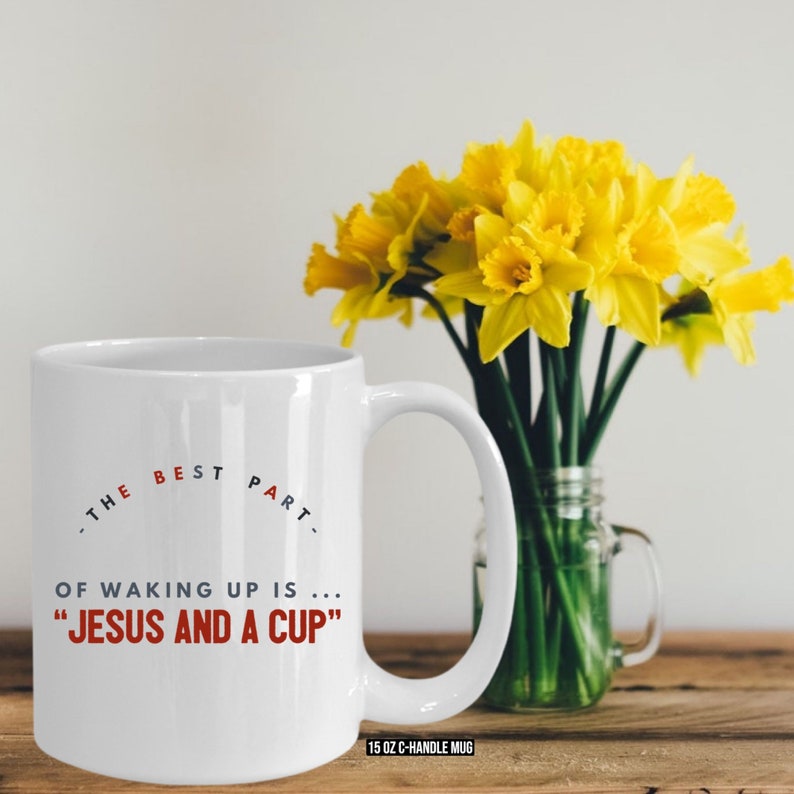 May include: White ceramic mug with a black and red design that says "THE BEST PART OF WAKING UP IS... "JESUS AND A CUP" and "15 OZ C-HANDLE MUG".