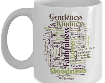May include: White ceramic mug with a word cloud design featuring the words "Gentleness", "Kindness", "Faithfulness", and "Goodness" in a green and purple color scheme.