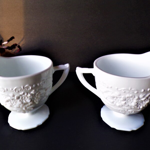 2 Indiana Glass Depression Era Ivory Flower and Leaf Footed Creamer Milk Glass