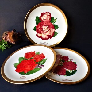 May include: A set of three ceramic mugs with a speckled, matte finish. The mugs are in shades of cream, light gray, and dark gray. Each mug has a simple, minimalist design, perfect for coffee or tea.