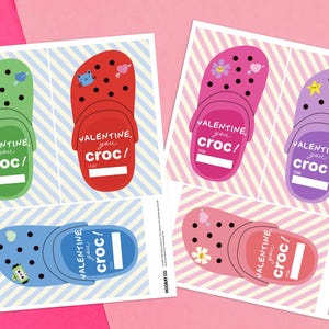 May include: Five printable Valentine's Day cards featuring colourful cartoon clogs with different decorations. Each card has the text "Valentine, you croc!" with a blank space for a name.