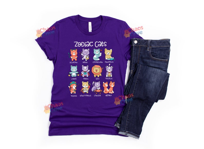 May include: Purple t-shirt with a graphic of cats representing each zodiac sign. The text "Zodiac Cats" is printed on the shirt.