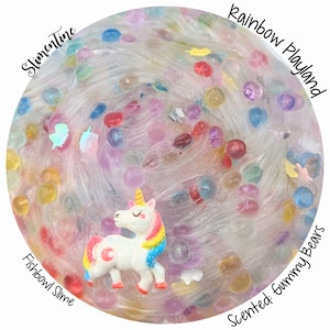 May include: Clear slime with rainbow colored beads and a white unicorn charm. The slime is labeled "Fishbowl Slime" and "Rainbow Playland". The slime is scented with "Gummy Bears".