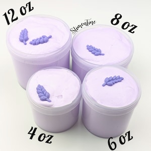 May include: Four clear plastic containers of lavender-colored slime with purple flower decorations. The containers are labeled 4 oz, 6 oz, 8 oz, and 12 oz. The text "Slimentine" is visible in the background.