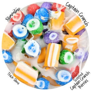 May include: A close-up of a white slime with colorful cereal pieces. The slime is thick and gooey, and the cereal pieces are scattered throughout. The cereal pieces are in the colors blue, green, yellow, orange, and purple. The slime is scented with Captain Crunch Berries.