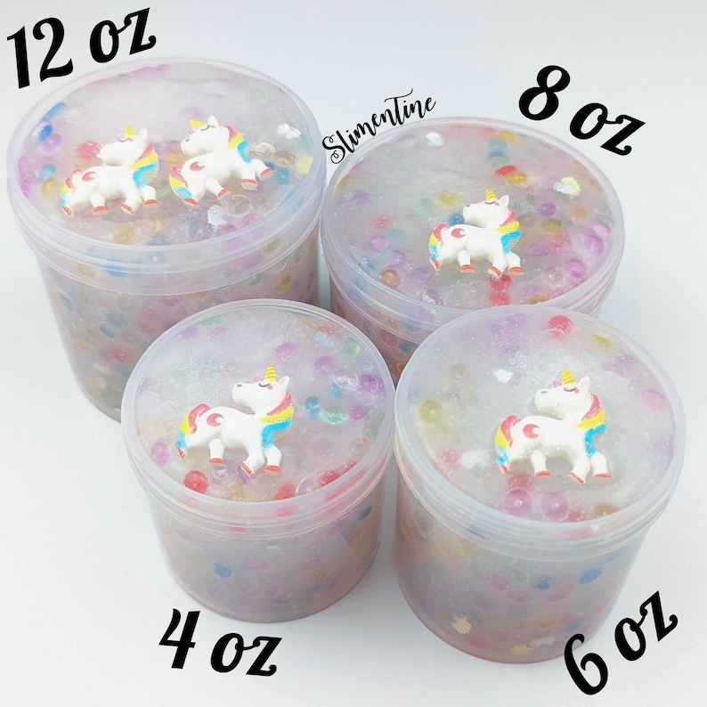 May include: Four clear containers of slime with unicorn charms. The containers are labeled 4 oz, 6 oz, 8 oz, and 12 oz.