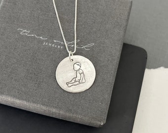 Baby necklace, sitting toddler charm, silver Stamped charm, gift for new mom, sterling silver baby pendant, baby with bow, handstamped