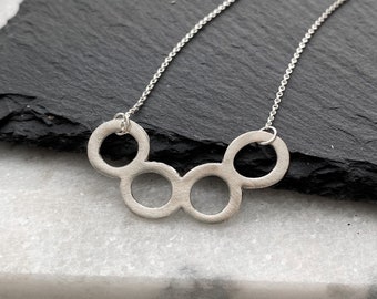 Sterling silver circle necklace, four open rings necklace, curved bar, metal clay jewelry, brushed silver pendant, Mother’s Day gift idea