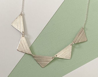 Patterned triangle necklace, lines pattern on triangles, geometric pendants, brushed matte silver, metal clay jewelry, statement necklace