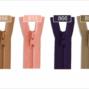 May include: Four plastic zippers arranged side-by-side in tan, coral, dark purple, and beige. Each zipper features a matching pull tab and a rectangular label at the top displaying the color codes 856, 813, 866, and 858 respectively.