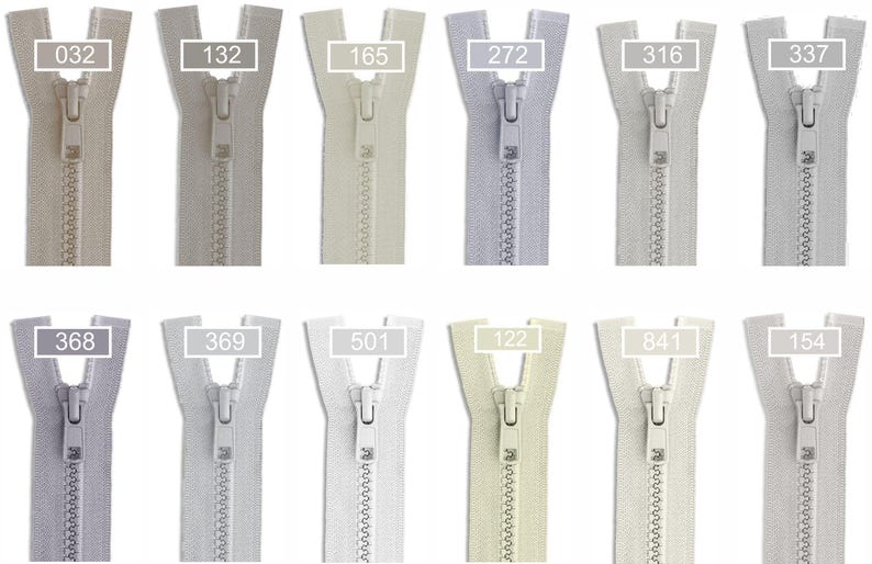 May include: A collection of twelve plastic zippers arranged in two rows, each featuring a unique neutral color shade. Every zipper includes a matching slider and a rectangular label displaying a specific identification number: 032, 132, 165, 272, 316, 337, 368, 369, 501, 122, 841, and 154.